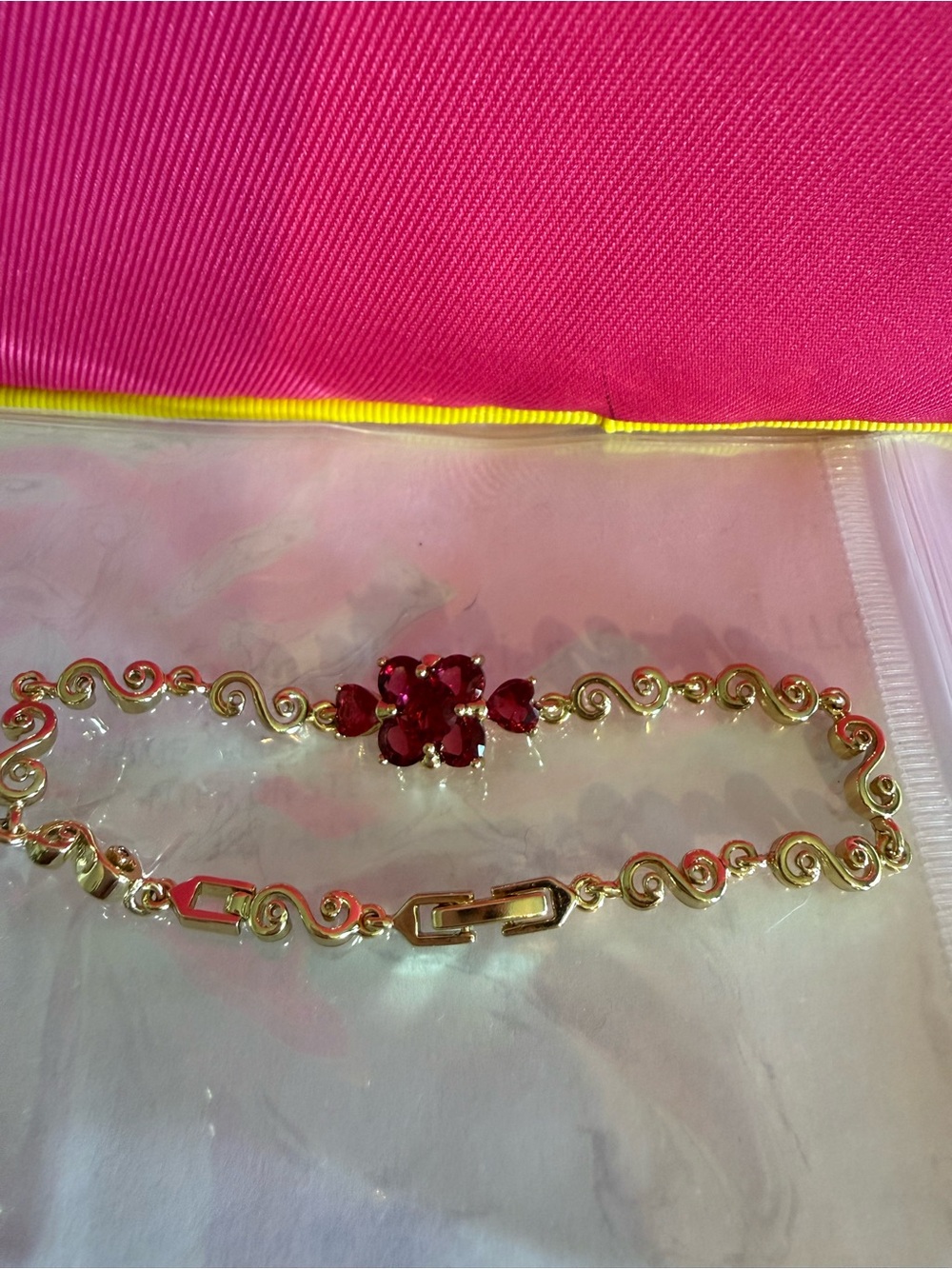 Gold-Tone Bracelet with Red Gem Flower Accent